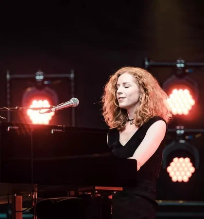 alina orlova performing and singing on a stage